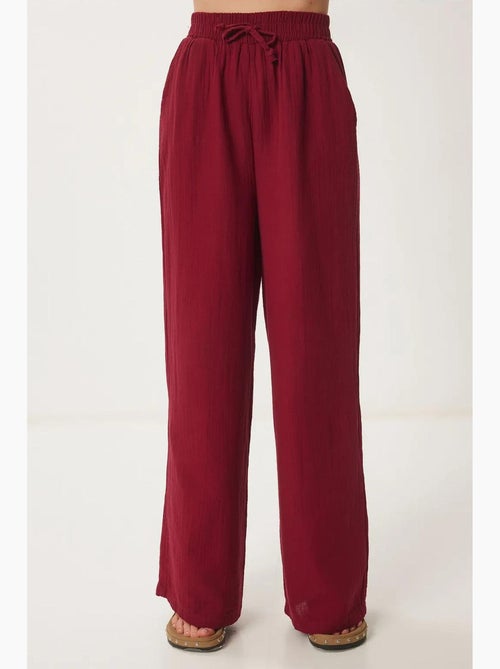 Pantaloni a gamba ampia con coulisse in vita e dettaglio con bordino istanbul - Kiabi Pantaloni a gamba ampia con coulisse in vita e dettaglio con bordino istanbul - Kiabi