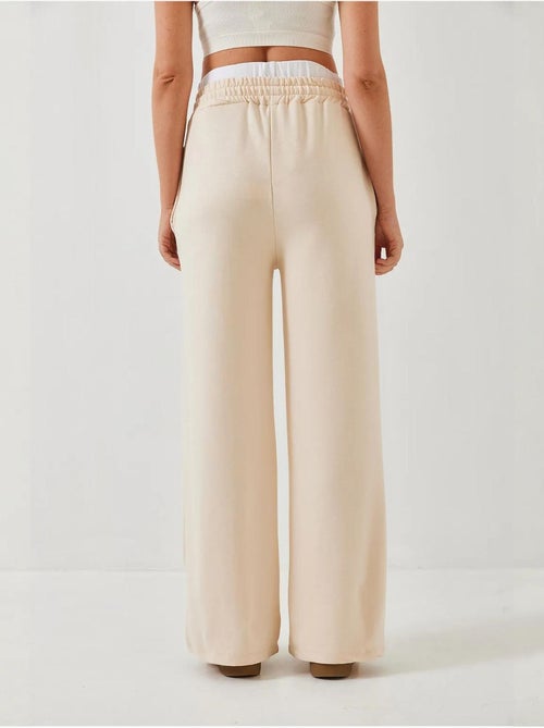 Pantaloni a gamba ampia con dettaglio cintura lucci - Kiabi Pantaloni a gamba ampia con dettaglio cintura lucci - Kiabi