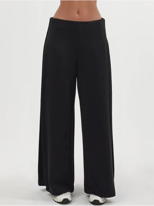 Pantaloni a gamba ampia con pieghe busem - Kiabi Pantaloni a gamba ampia con pieghe busem - Kiabi