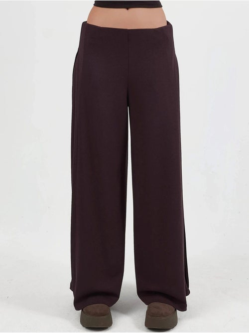 Pantaloni a gamba ampia con pieghe busem - Kiabi Pantaloni a gamba ampia con pieghe busem - Kiabi