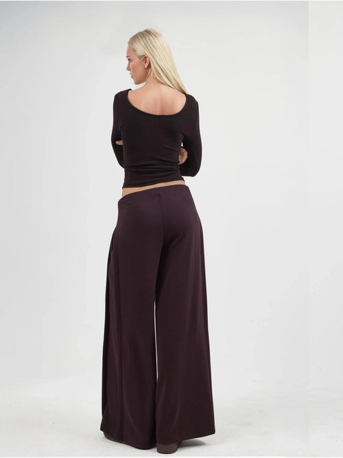 Pantaloni a gamba ampia con pieghe busem - Kiabi Pantaloni a gamba ampia con pieghe busem - Kiabi