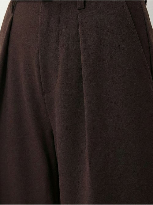 Pantaloni a gamba ampia con pieghe e cintura istanbul - Kiabi Pantaloni a gamba ampia con pieghe e cintura istanbul - Kiabi