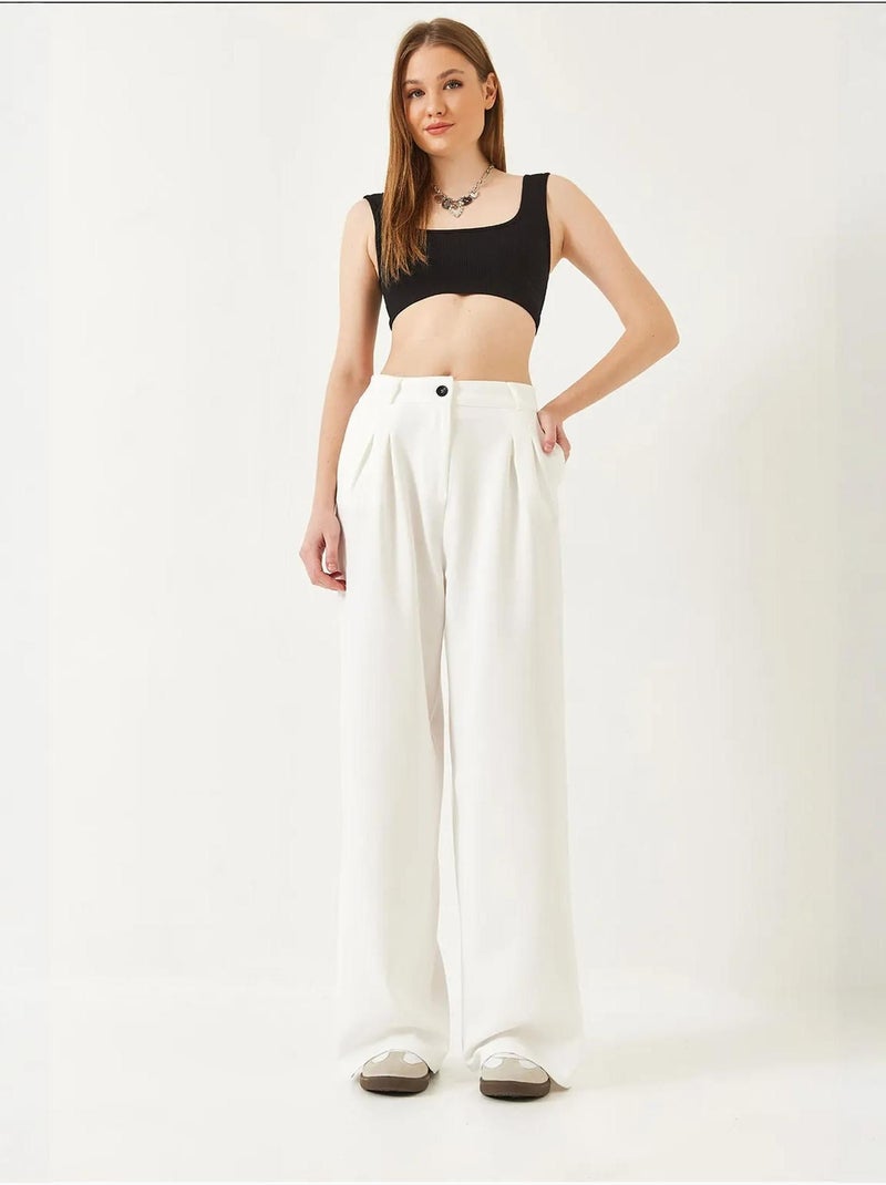 Pantaloni a gamba ampia con pieghe lucci Bianco - Kiabi
