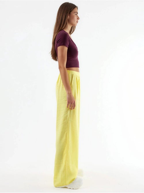 Pantaloni a gamba ampia con pince busem - Kiabi Pantaloni a gamba ampia con pince busem - Kiabi