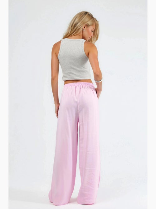 Pantaloni a gamba ampia con pince busem - Kiabi Pantaloni a gamba ampia con pince busem - Kiabi