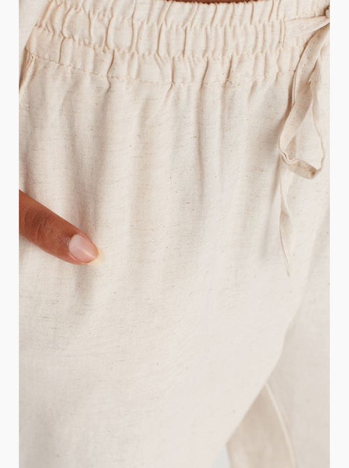 Pantaloni a gamba ampia con vita con coulisse dilvin - Kiabi Pantaloni a gamba ampia con vita con coulisse dilvin - Kiabi