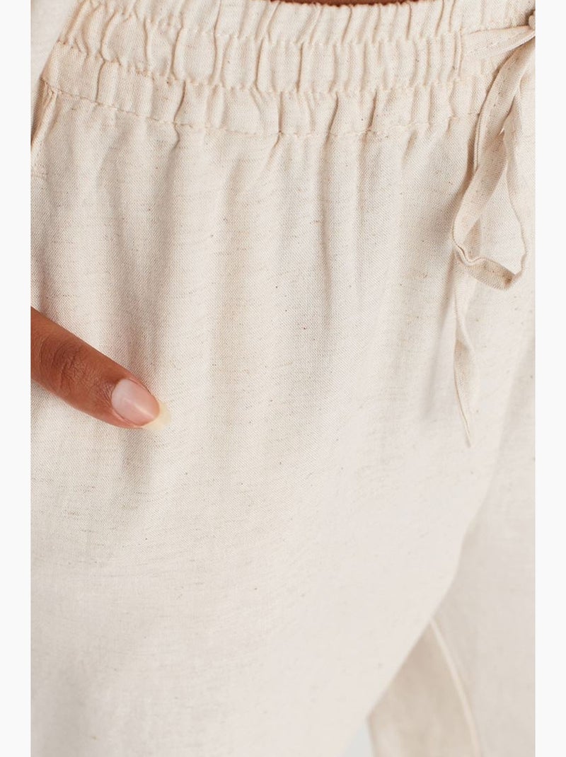 Pantaloni a gamba ampia con vita con coulisse dilvin Beige naturale - Kiabi