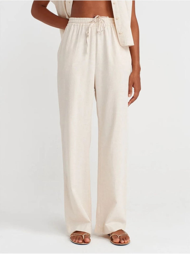 Pantaloni a gamba ampia con vita con coulisse dilvin Beige naturale - Kiabi