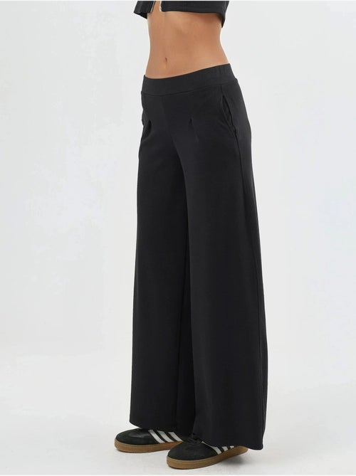 Pantaloni a gamba ampia con vita elasticizzata busem - Kiabi Pantaloni a gamba ampia con vita elasticizzata busem - Kiabi