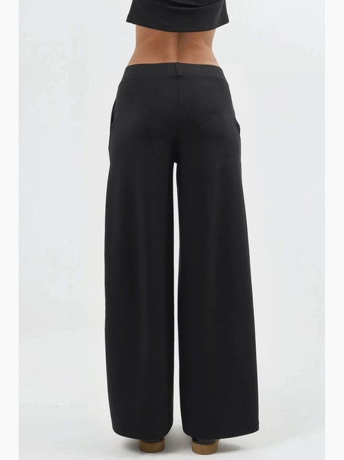 Pantaloni a gamba ampia con vita elasticizzata busem - Kiabi Pantaloni a gamba ampia con vita elasticizzata busem - Kiabi