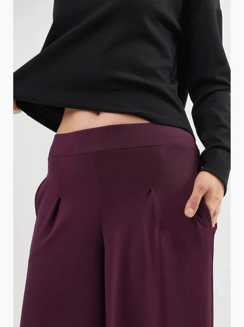 Pantaloni a gamba ampia con vita elasticizzata busem - Kiabi Pantaloni a gamba ampia con vita elasticizzata busem - Kiabi