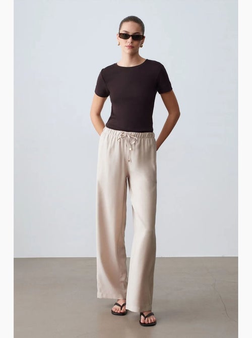 Pantaloni a gamba ampia con vita elasticizzata e coulisse dilvin - Kiabi Pantaloni a gamba ampia con vita elasticizzata e coulisse dilvin - Kiabi