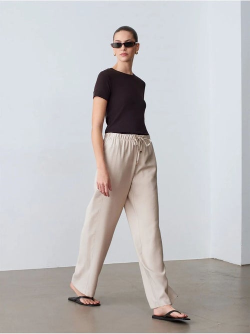 Pantaloni a gamba ampia con vita elasticizzata e coulisse dilvin - Kiabi Pantaloni a gamba ampia con vita elasticizzata e coulisse dilvin - Kiabi