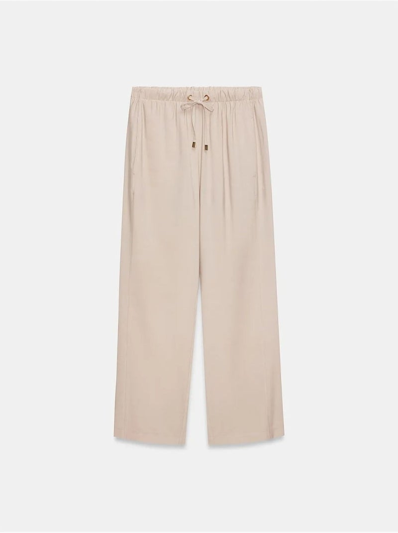 Pantaloni a gamba ampia con vita elasticizzata e coulisse dilvin Sabbia - Kiabi