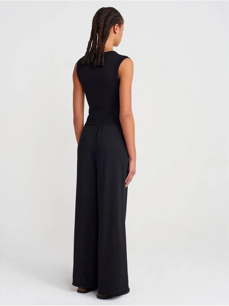 Pantaloni a gamba ampia in crêpe da donna Nero - Kiabi