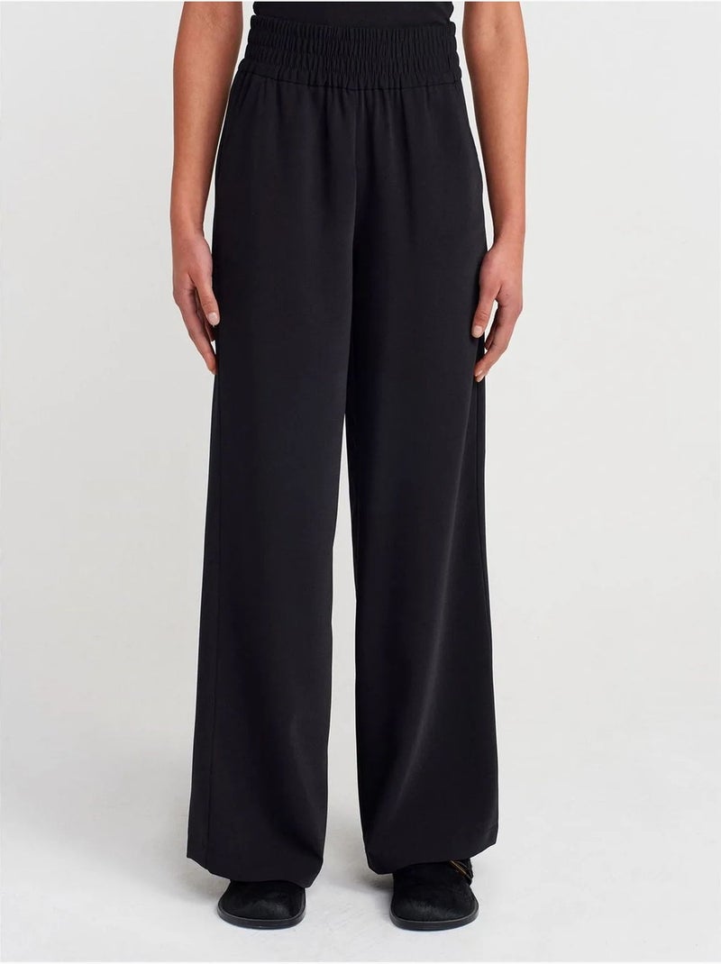 Pantaloni a gamba ampia in crêpe da donna Nero - Kiabi