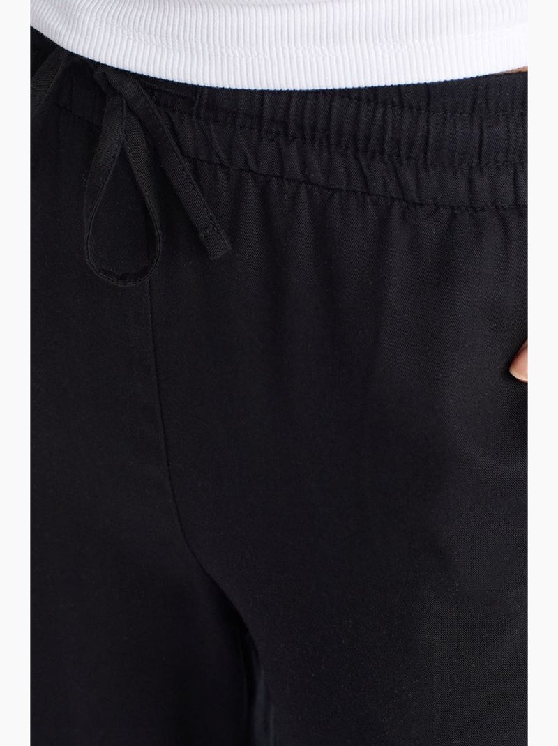 Pantaloni a gamba ampia in tencel con vita con coulisse dilvin Nero - Kiabi