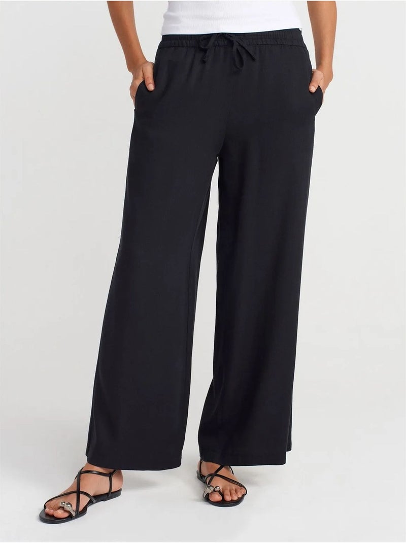 Pantaloni a gamba ampia in tencel con vita con coulisse dilvin Nero - Kiabi