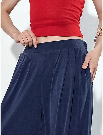 Pantaloni a gamba ampia plissettati con tasche busem