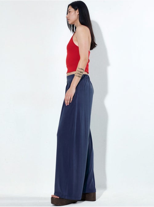 Pantaloni a gamba ampia plissettati con tasche busem - Kiabi Pantaloni a gamba ampia plissettati con tasche busem - Kiabi