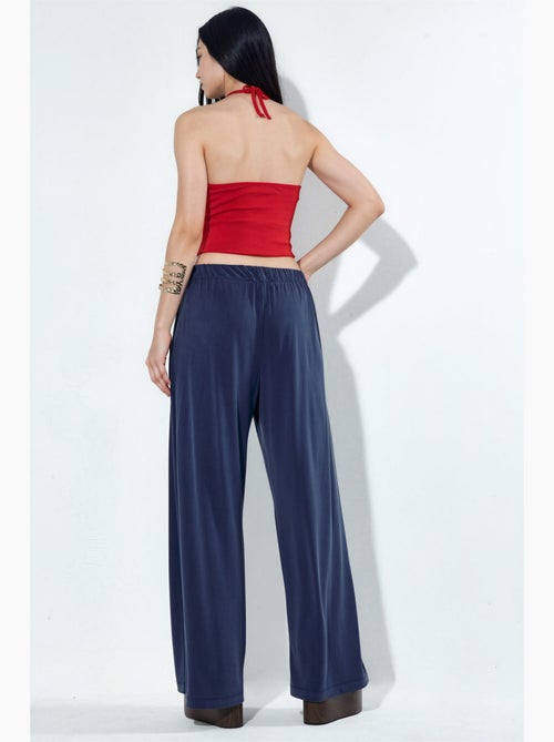 Pantaloni a gamba ampia plissettati con tasche busem - Kiabi Pantaloni a gamba ampia plissettati con tasche busem - Kiabi