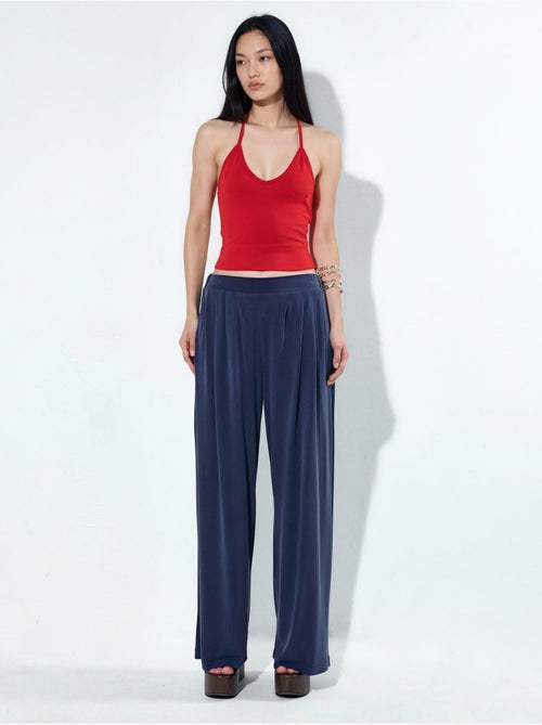 Pantaloni a gamba ampia plissettati con tasche busem - Kiabi Pantaloni a gamba ampia plissettati con tasche busem - Kiabi