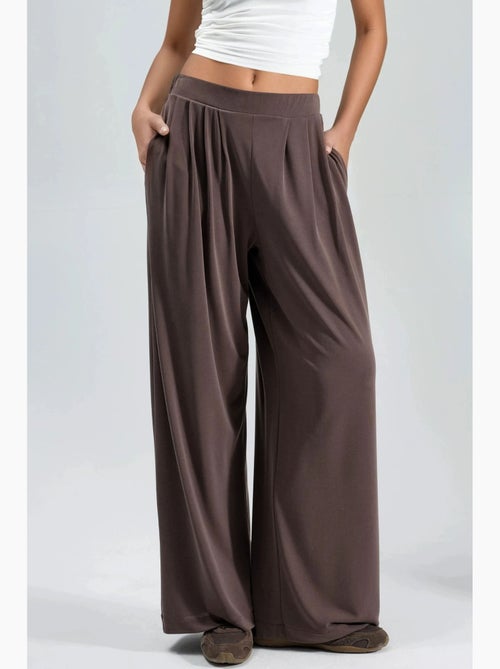 Pantaloni a gamba ampia plissettati con tasche busem - Kiabi Pantaloni a gamba ampia plissettati con tasche busem - Kiabi
