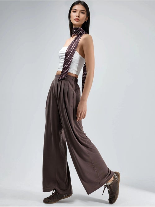 Pantaloni a gamba ampia plissettati con tasche busem - Kiabi Pantaloni a gamba ampia plissettati con tasche busem - Kiabi
