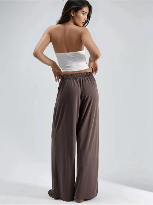 Pantaloni a gamba ampia plissettati con tasche busem - Kiabi Pantaloni a gamba ampia plissettati con tasche busem - Kiabi
