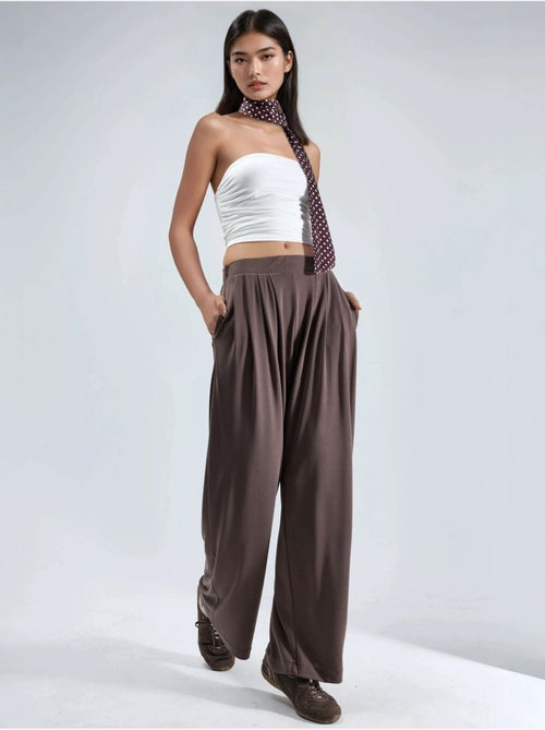 Pantaloni a gamba ampia plissettati con tasche busem - Kiabi Pantaloni a gamba ampia plissettati con tasche busem - Kiabi