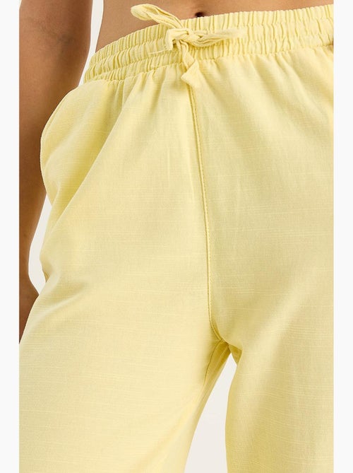 Pantaloni a gamba ampia relaxed fit con coulisse lucci - Kiabi Pantaloni a gamba ampia relaxed fit con coulisse lucci - Kiabi