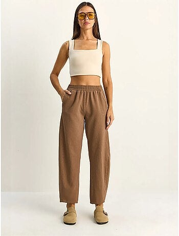 Pantaloni a gamba dritta con vita elastica e tasche lucci