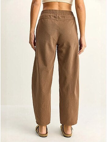Pantaloni a gamba dritta con vita elastica e tasche lucci