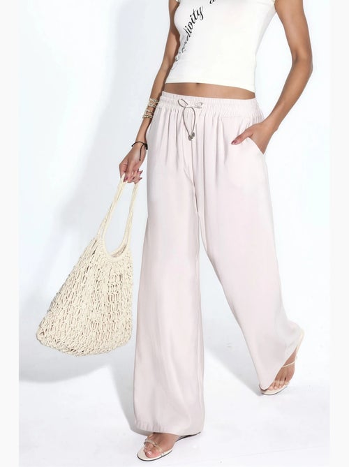 Pantaloni a gamba dritta con vita elasticizzata e tocco modal hiccup - Kiabi Pantaloni a gamba dritta con vita elasticizzata e tocco modal hiccup - Kiabi