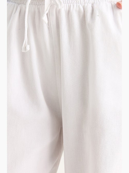 Pantaloni a gamba dritta con vita elasticizzata lucci - Kiabi Pantaloni a gamba dritta con vita elasticizzata lucci - Kiabi