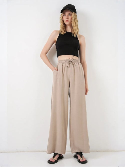 Pantaloni a gamba larga a vita alta con tasca bdart - Kiabi Pantaloni a gamba larga a vita alta con tasca bdart - Kiabi