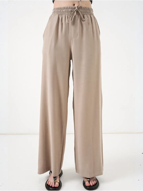 Pantaloni a gamba larga a vita alta con tasca bdart - Kiabi Pantaloni a gamba larga a vita alta con tasca bdart - Kiabi