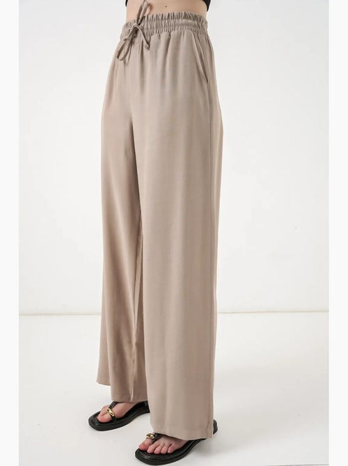 Pantaloni a gamba larga a vita alta con tasca bdart - Kiabi Pantaloni a gamba larga a vita alta con tasca bdart - Kiabi