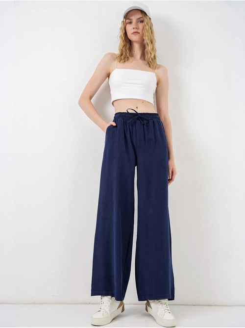 Pantaloni a gamba larga a vita alta con tasca bdart - Kiabi Pantaloni a gamba larga a vita alta con tasca bdart - Kiabi
