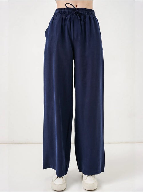 Pantaloni a gamba larga a vita alta con tasca bdart - Kiabi Pantaloni a gamba larga a vita alta con tasca bdart - Kiabi