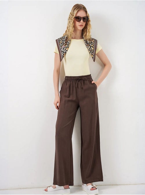 Pantaloni a gamba larga a vita alta con tasca bdart - Kiabi Pantaloni a gamba larga a vita alta con tasca bdart - Kiabi