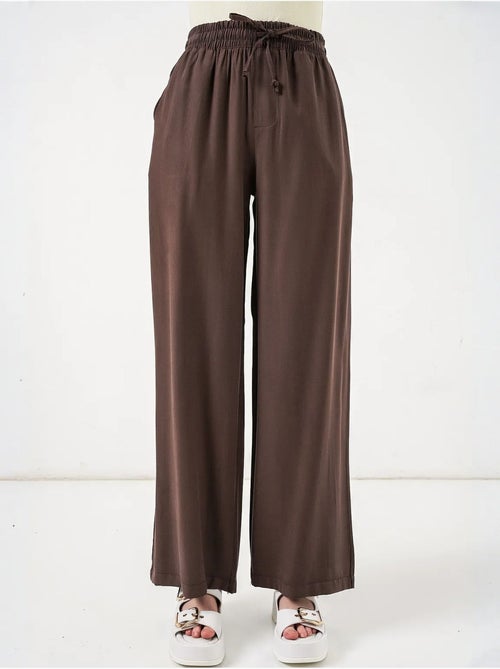 Pantaloni a gamba larga a vita alta con tasca bdart - Kiabi Pantaloni a gamba larga a vita alta con tasca bdart - Kiabi