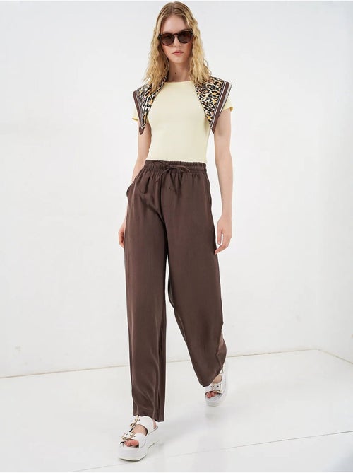 Pantaloni a gamba larga a vita alta con tasca bdart - Kiabi Pantaloni a gamba larga a vita alta con tasca bdart - Kiabi
