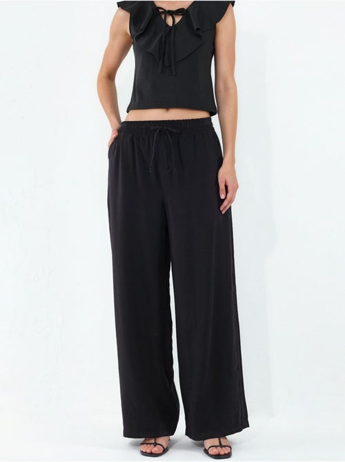 Pantaloni a gamba larga a vita alta con tasca bdart - Kiabi Pantaloni a gamba larga a vita alta con tasca bdart - Kiabi