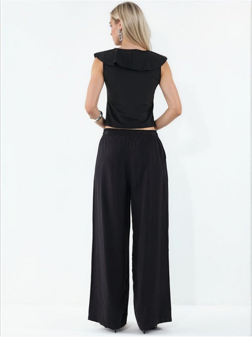 Pantaloni a gamba larga a vita alta con tasca bdart - Kiabi Pantaloni a gamba larga a vita alta con tasca bdart - Kiabi