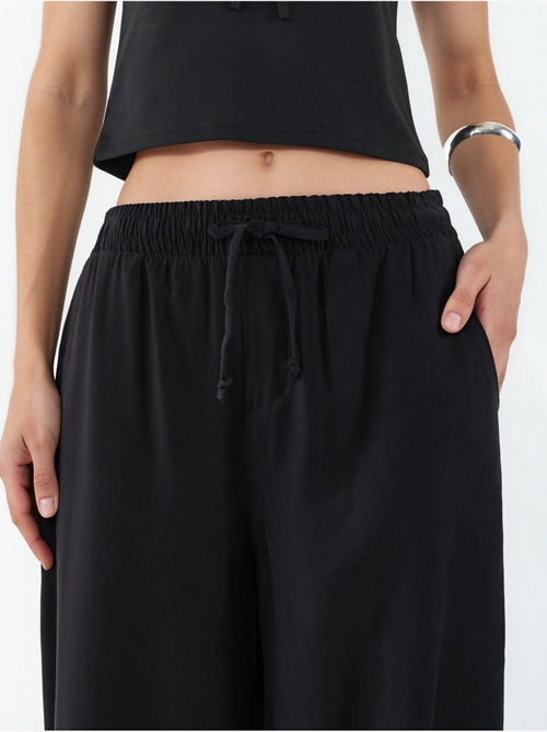 Pantaloni a gamba larga a vita alta con tasca bdart - Kiabi Pantaloni a gamba larga a vita alta con tasca bdart - Kiabi