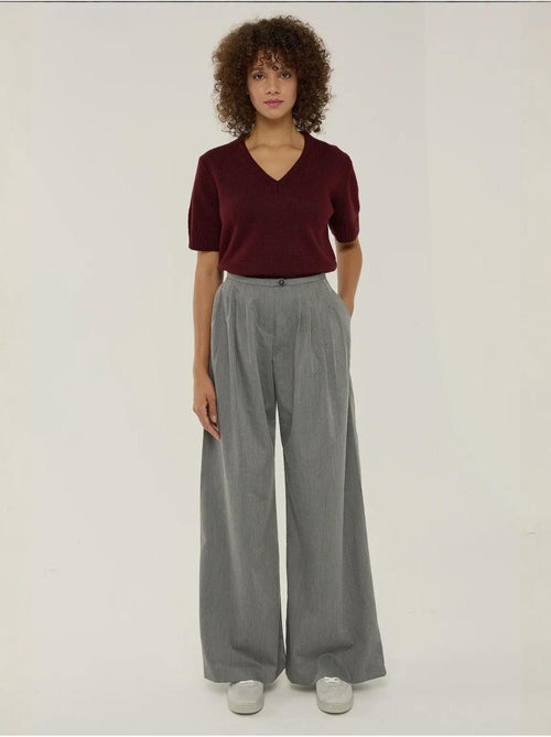 Pantaloni a gamba larga con pieghe hiccup - Kiabi Pantaloni a gamba larga con pieghe hiccup - Kiabi