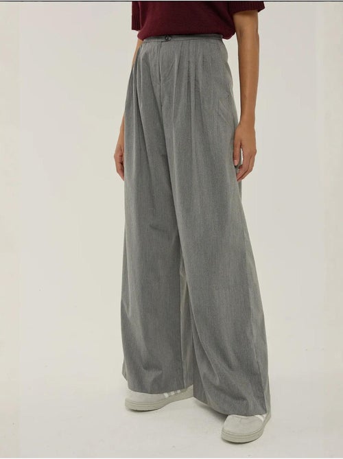 Pantaloni a gamba larga con pieghe hiccup - Kiabi Pantaloni a gamba larga con pieghe hiccup - Kiabi