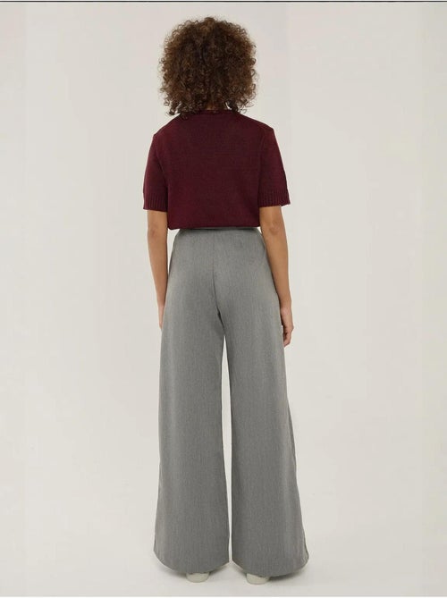 Pantaloni a gamba larga con pieghe hiccup - Kiabi Pantaloni a gamba larga con pieghe hiccup - Kiabi