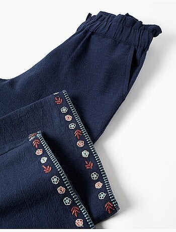 Pantaloni a gamba larga in cotone con fiori ricamati